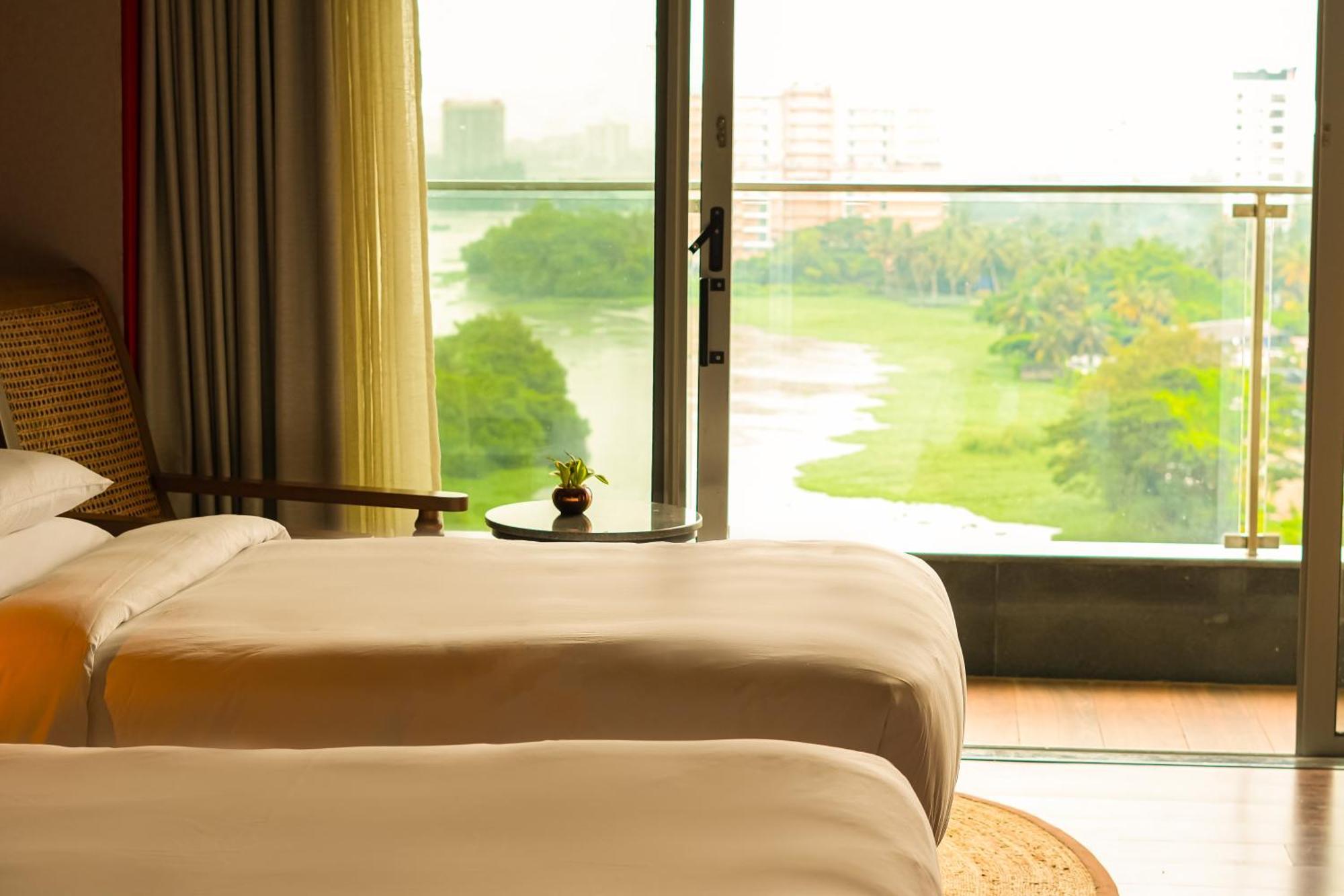 Twin Room with Backwaters View with Balcony , Happy Hours from 11 AM to 6.30 PM